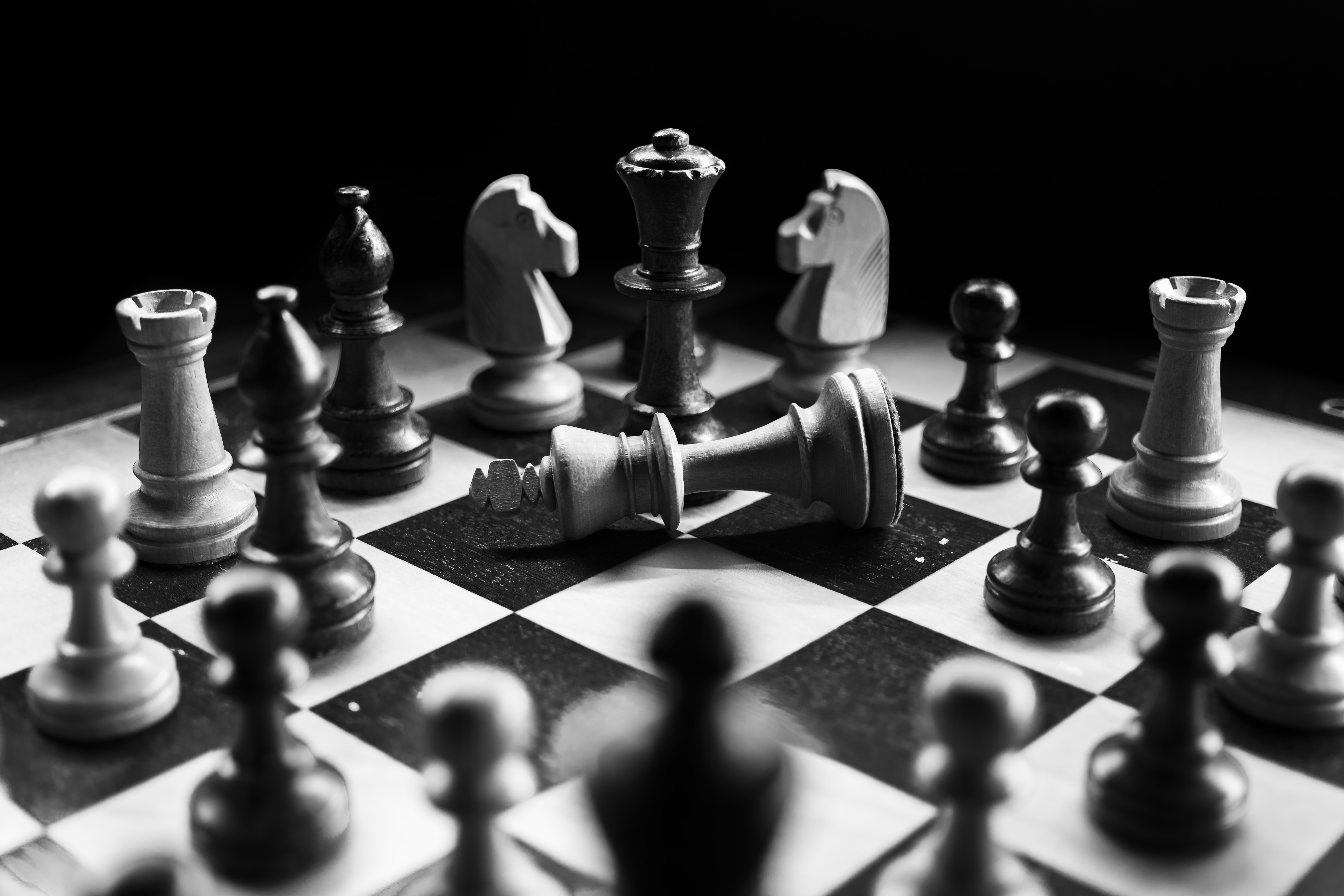 Chess pieces on a board as illustration to the blog post by Liz BlackX
Photo by Felix Mittermeier on Unsplash