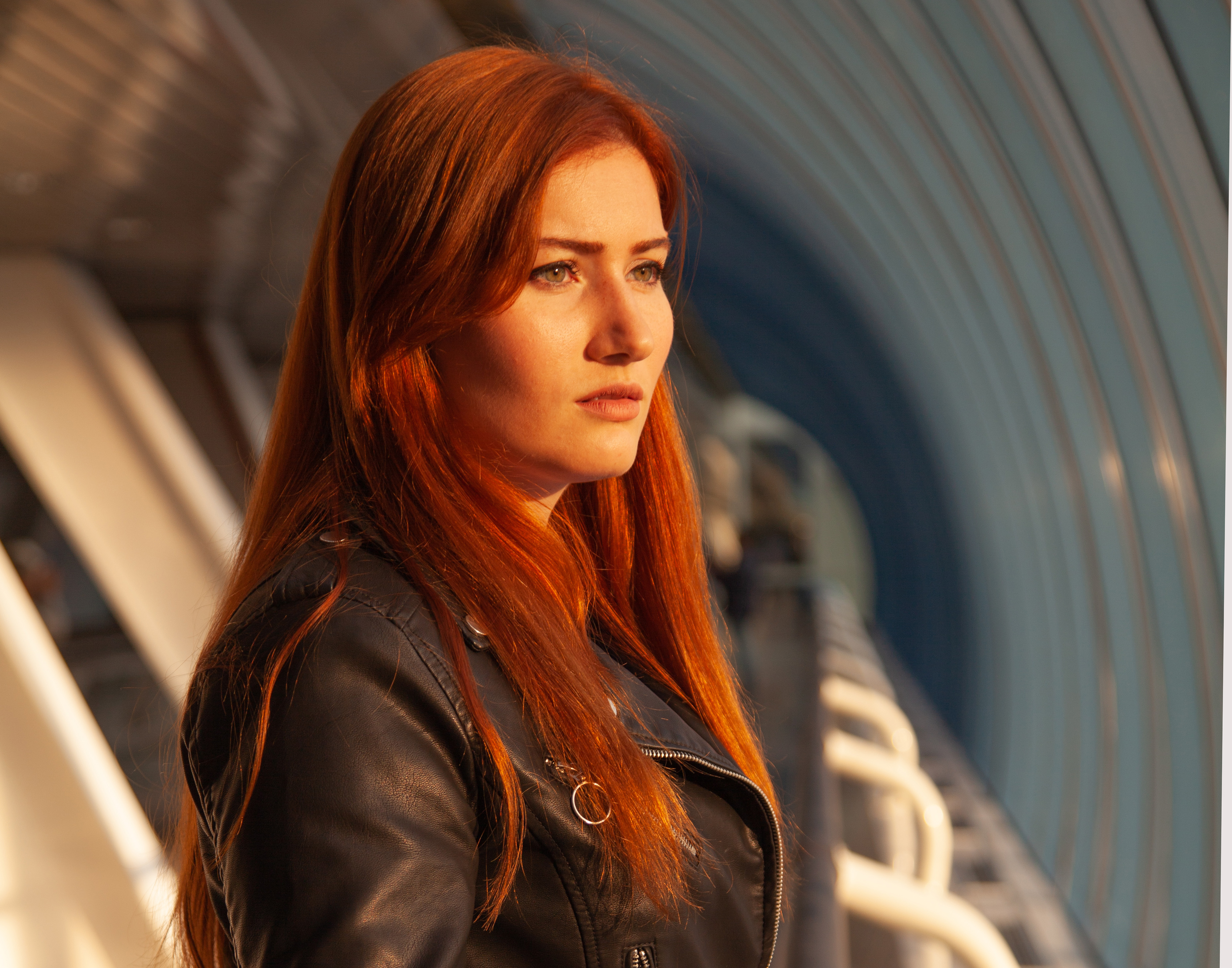 pretty young woman in blue dress and black leather jacket
Picture from Depositphotos.com